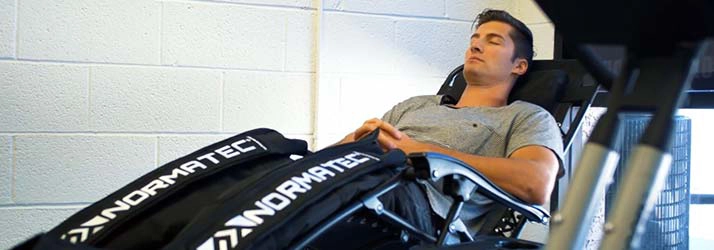 A patient relaxing during Normatec decompression therapy