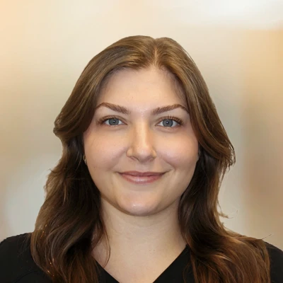 A headshot photo of Emily